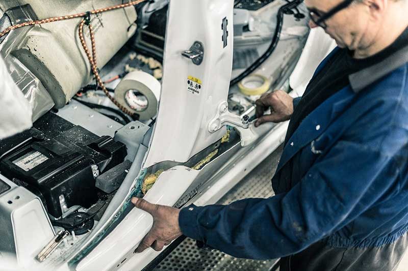 factory worker customizing Range Rover Adventum SUV Coupe
