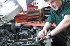 technician working on Land Rover engine